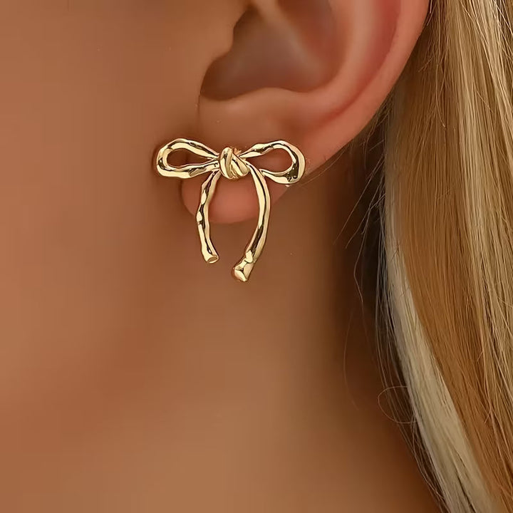 Par de pendientes elegantes con lazo de cinta