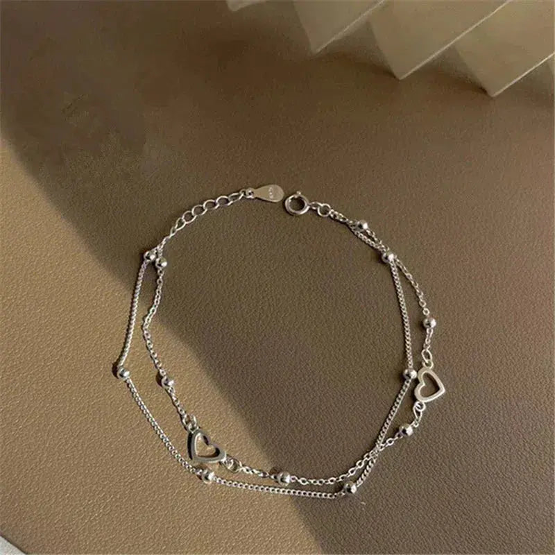 Pulsera ajustable de plata con corazón
