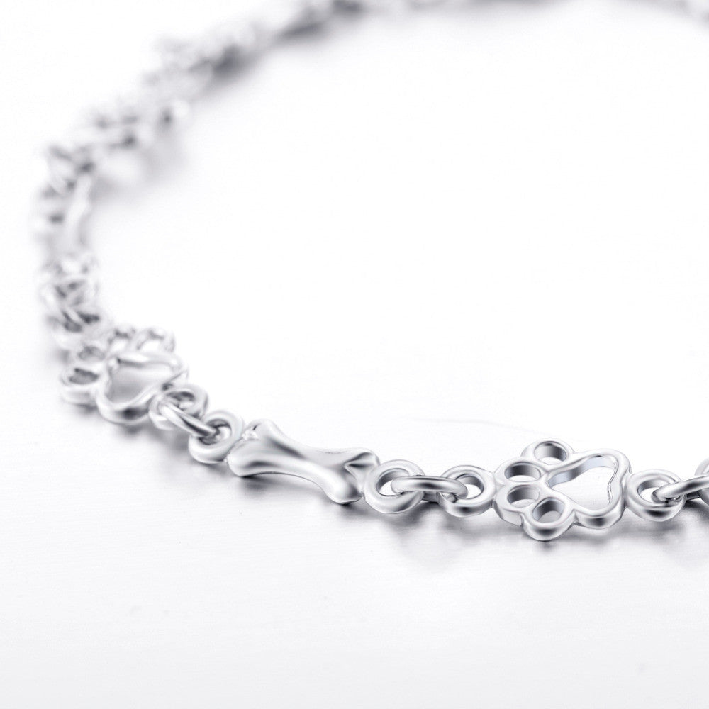 Pulsera con Colgantes de Pata de Perro y Hueso en Plata Pura