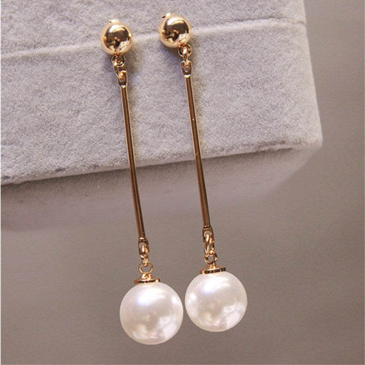 Pendientes colgantes de lujo con perlas especiales colocadas a mano