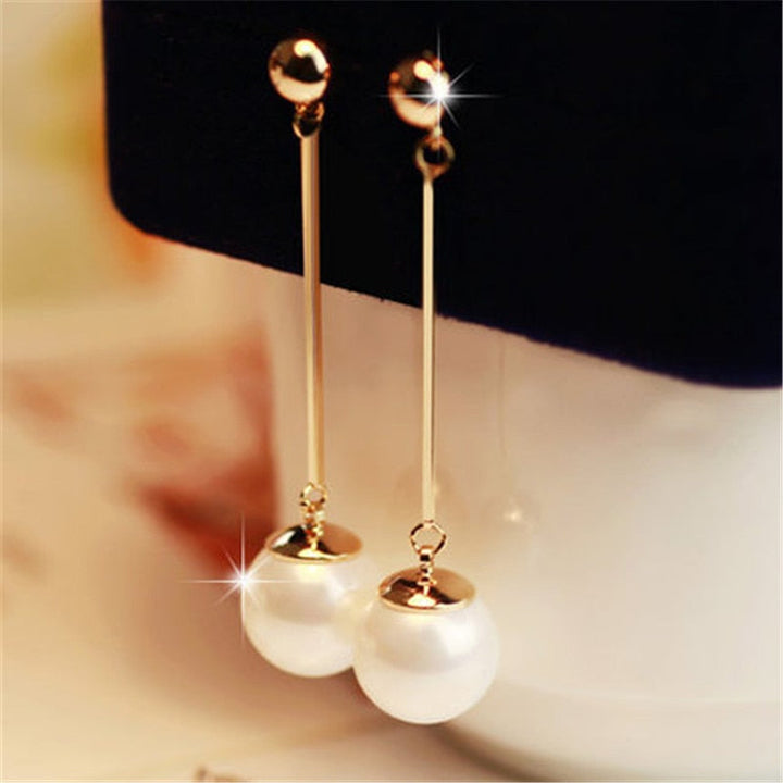 Pendientes colgantes de lujo con perlas especiales colocadas a mano