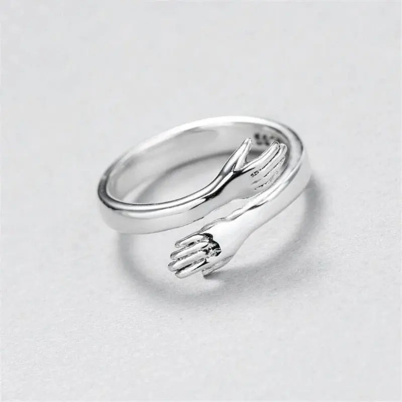 Anillo ajustable tipo abrazo en plata