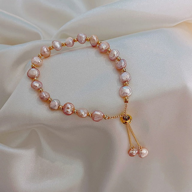 Pulsera de perlas rosas en oro