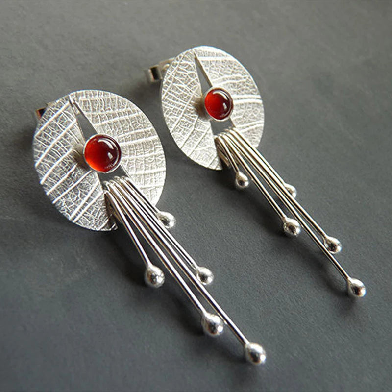 Pendientes colgantes con piedra roja hueca