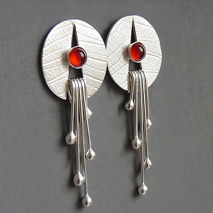 Pendientes colgantes con piedra roja hueca
