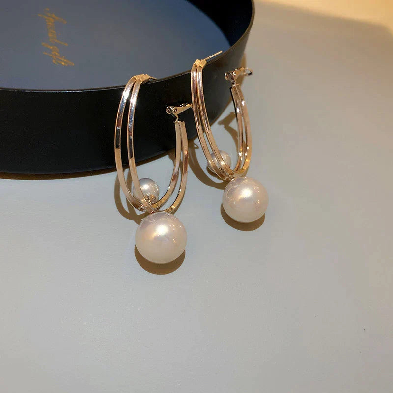 Pendientes encantadores con perlas