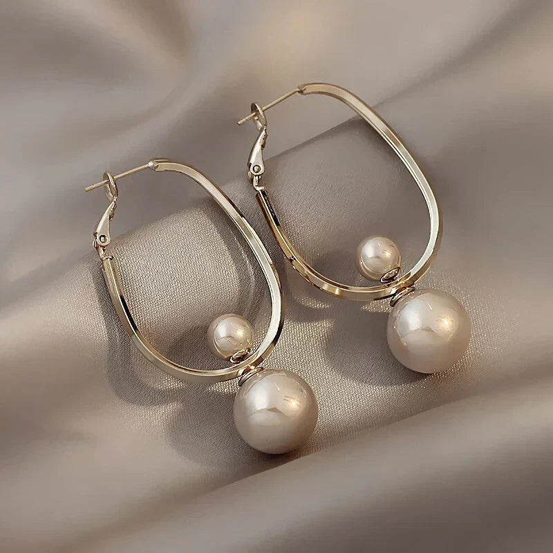 Pendientes encantadores con perlas