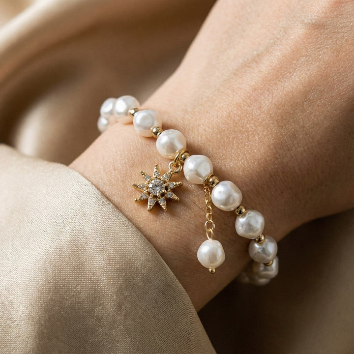 Pulsera con colgante en oro blanco, perla y girasol