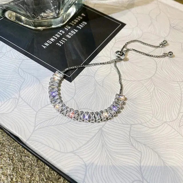 Pulsera ajustable de circonita cúbica en oro y plata