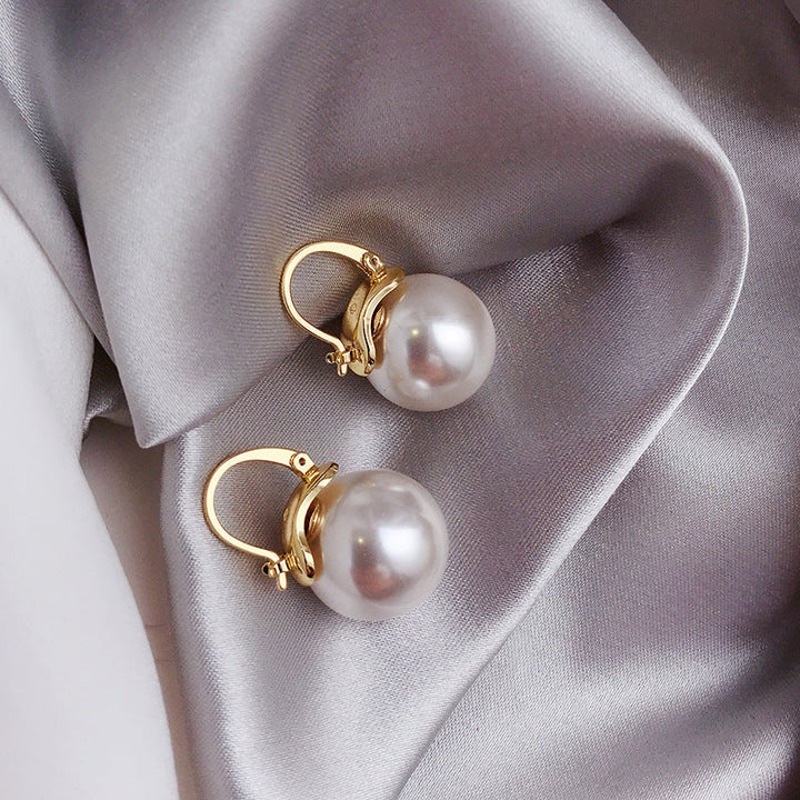 Pendientes gruesos con perlas en oro