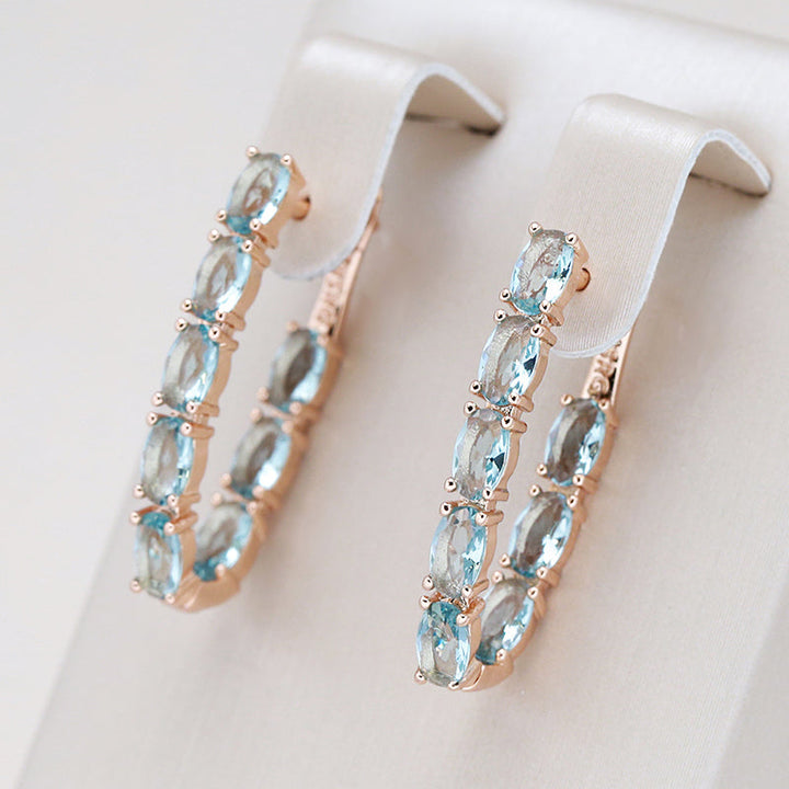 Elegantes pendientes con turquesa y circonita en oro
