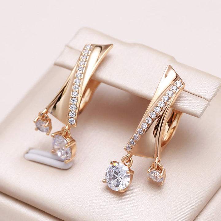 Elegantes pendientes irregulares en oro y circonitas