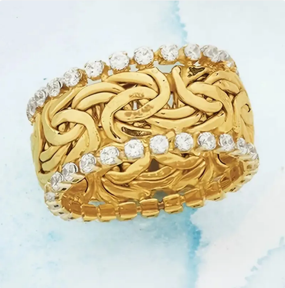 Anillo con banda de cristal trenzado dorado