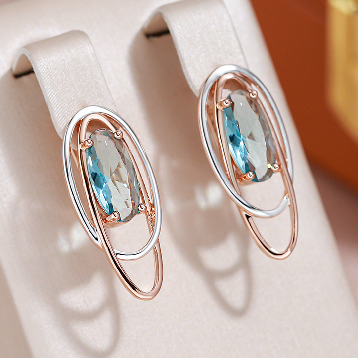 Elegantes pendientes con cristal turquesa en oro y plata