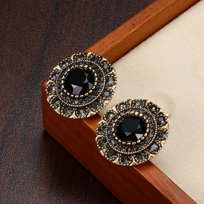 Elegantes pendientes redondos de cristal negro