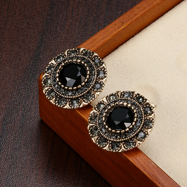 Elegantes pendientes redondos de cristal negro