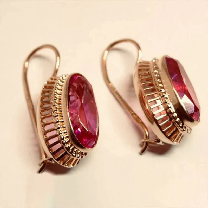 Pendientes en oro rosa con piedras rojas
