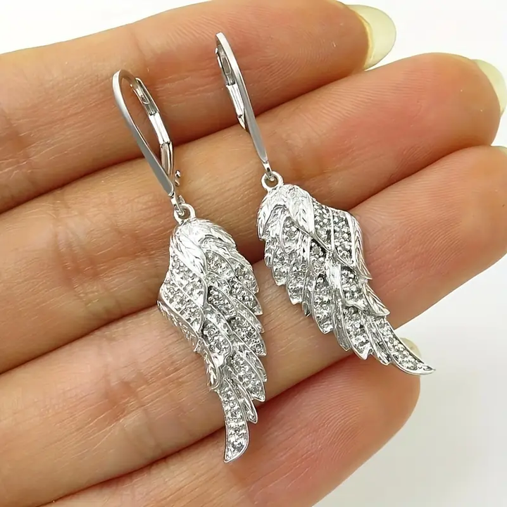 Pendientes de plata con alas brillantes